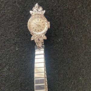 Elegant Silver Watch with Floral Design